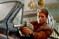 Arnold Schwarzenegger, alias Jack Slater (mais aussi lui-même) dans  Last Action Hero  de John McTiernan (1993).
