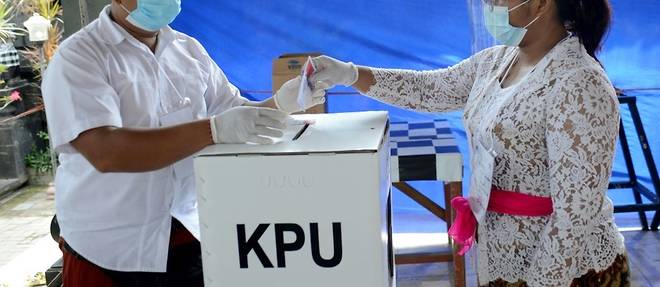 Les Indonesiens votent malgre les craintes d'une acceleration de l'epidemie