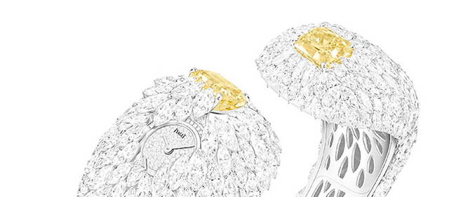 Ce bracelet serti de diamants taille marquise entourant deux diamants jaunes Fancy Vivid Yellow est la piece maitresse de la collection de haute joaillerie Piaget.
