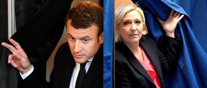 Marine Le Pen, candidate du Rassemblement national, et Emmanuel Macron, candidat d'En marche ! a l'election presidentielle de 2017, sortent tous les deux de l'isoloir lors du vote de second tour,  le 7 mai 2017. 
