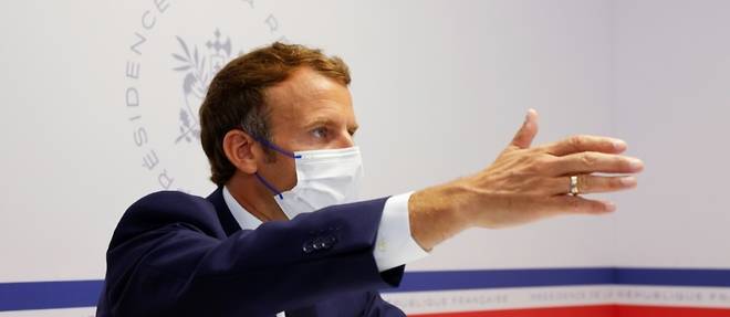 Macron defend la gestion "democratique" de la crise sanitaire
