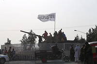 Une patrouille talibane fait régner l'ordre à Kaboul.
