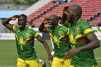Mali's midfielder Amadou Haidara (L) and Mali's defender Hamari Traore celebrate the goal scored by Mali's forward Ibrahima Kone (R)  during the Group F Africa Cup of Nations (CAN) 2021 football match between Tunisia and Mali at Limbe Omnisport Stadium in Limbe on January 12, 2022. (Photo by Issouf SANOGO / AFP)
