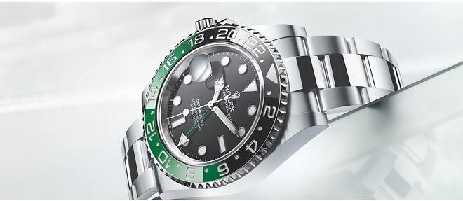 Montre Rolex Oyster Perpetual GMT-Master II, premier modele commercialise de la marque avec couronne a gauche.
