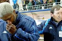 Djibril Cissé et Guy Roux, deux figures iconiques de l'AJ Auxerre.

