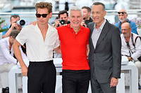 L'équipe du film « Elvis » : de gauche à droite, Austin Butler, Baz Luhrmann et Tom Hanks lors du photocall à Cannes.  
