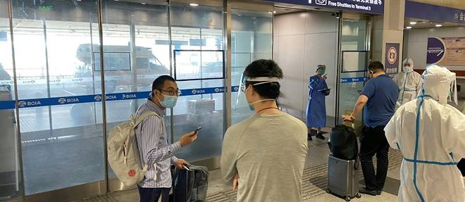 La Chine reduit de moitie la quarantaine pour les arrivees de l'etranger