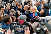 France s far-right party Rassemblement National (RN) leader Marine Le Pen talks with journalists as she attends an election evening following the first round of France s parliamentary elections in Henin-Beaumont, northern France, on June 12, 2022. Elections for the 577 seats in the lower house National Assembly are a two-round process, with the shape of the new parliament becoming clear only after the second round on June 19. Marine Le Pen, leader du Rassemblement national (RN), parti d extreme droite francais, assiste a une soiree electorale apres le premier tour des elections legislatives francaises a Henin-Beaumont, dans le nord de la France, le 12 juin 2022. (Photo by Jaak Moineau / Hans Lucas / Hans Lucas via AFP)