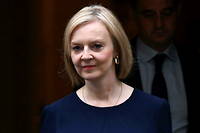 (FILES) In this file photo taken on September 23, 2022 Britain's Prime Minister Liz Truss walks out of Number 10 Downing Street on her way to the House of Commons for the government's anti-inflation budget plan in London. - UK Prime Minister Liz Truss on September 29, 2022 defended her tax cuts policy, despite it triggering market turmoil and forcing a Bank of England intervention to prevent 