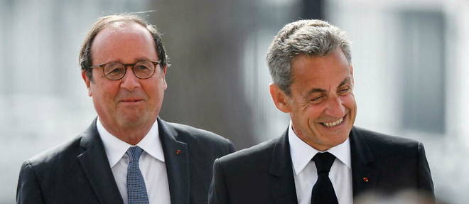 Les ex-presidents Francois Hollande et Nicolas Sarkozy assistent a une ceremonie marquant la fin de la Seconde Guerre mondiale a l'Arc de Triomphe, a Paris, le 8 mai 2020.
