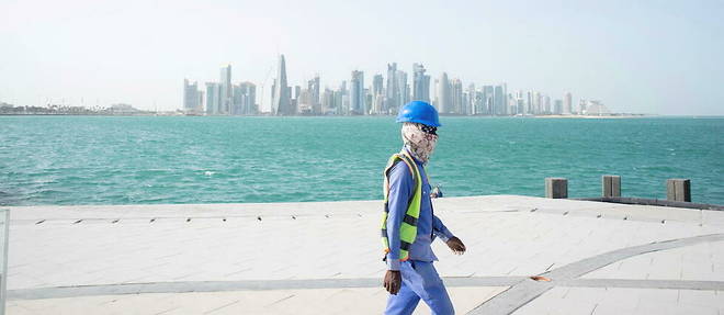 A worker on the Doha Corniche in May.  Qatar will host the World Cup from November 20 to December 18.