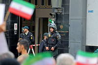 Iranian security forces stand guard outside the German embassy headquarters in Iran's capital Tehran on November 1, 2022 as protesters gather for an anti-German demonstration, condemning Germany's support of Berlin-based Iranian opposition TV stations and anti-government protests in Iran. (Photo by ATTA KENARE / AFP)