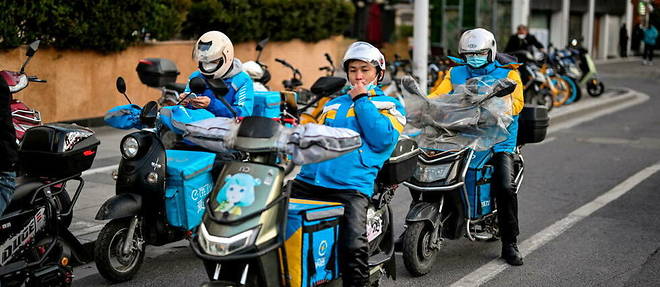 Delivery men in a suburb of Shanghai.
