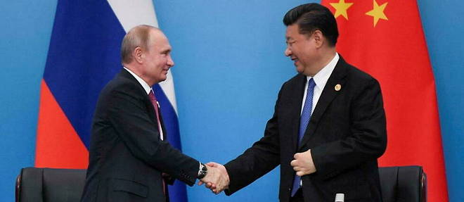 Vladimir Putin and Xi Jinping during a Shanghai Cooperation Organization summit meeting in China in 2018. 
