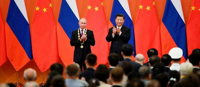 Le president russe Vladimir Poutine  et le president chinois Xi Jinping, a Pekin, en 2018.
