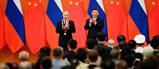 Le président russe Vladimir Poutine  et le président chinois Xi Jinping, à Pékin, en 2018.
