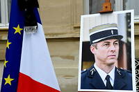 Portait du colonel Arnaud Beltrame lors de l'hommage national qui lui a ete rendu le 28 mars 2018 dans la cour des Invalides.
