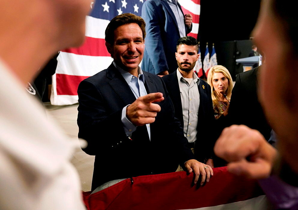 Heavy weights.  Florida Governor Ron DeSantis campaigning in Clive, Iowa, May 30.